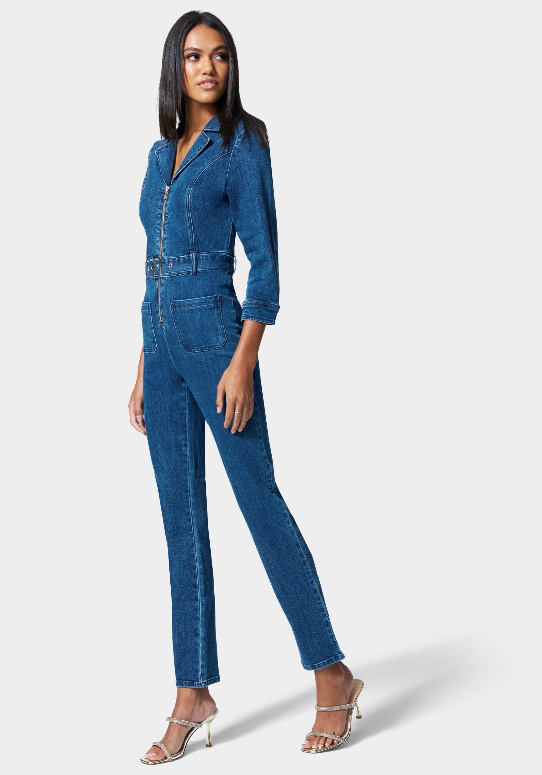 Zip Front Belted Skinny Leg Denim Jumpsuit | bebe