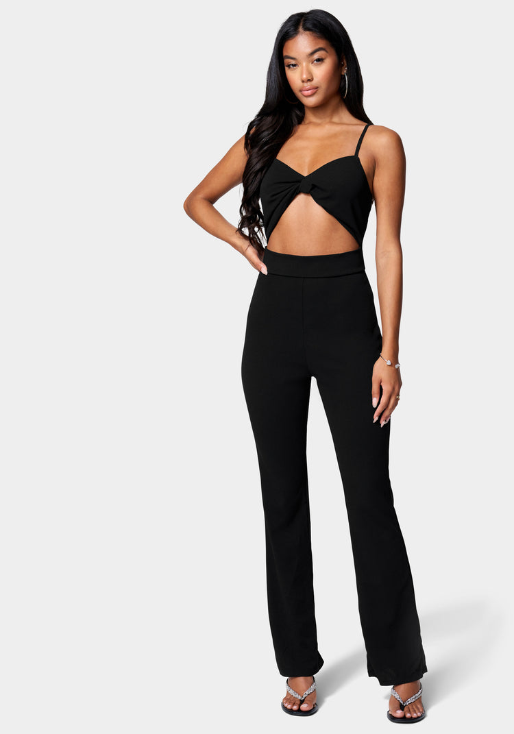 Lace Detailed Ruffle Jumpsuit With A Deep Open Front And A Wide
